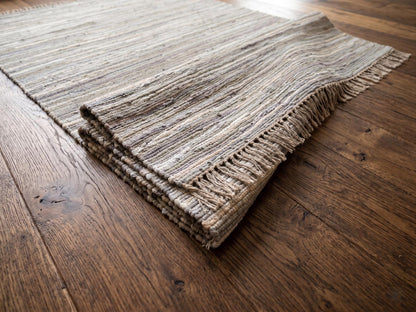 Handwoven Neutral Area Rug with Fringe