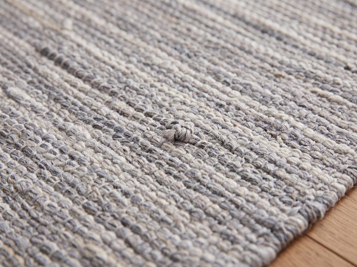 Handwoven Neutral Area Rug with Fringe